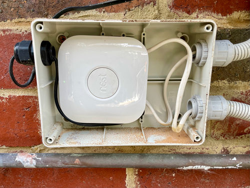 Photo of a Nest Heatlink unit mounted inside a weatherproof box